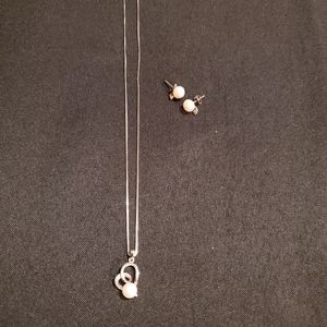 Sterling silver Pearl and cubic zirconia pendant and earring set.